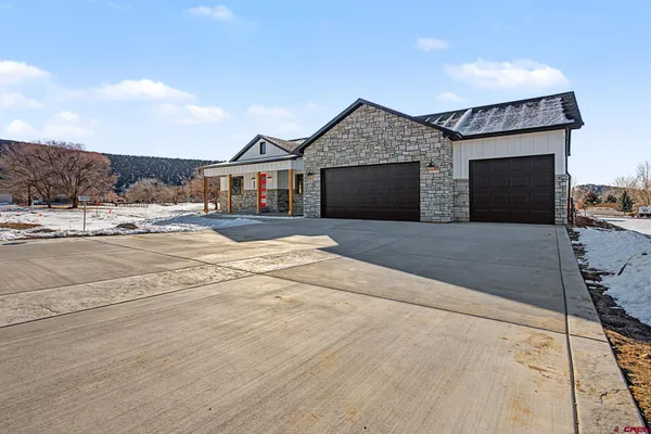 a front view of a house with yard
