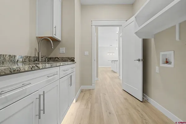 a bathroom with a sink and mirror