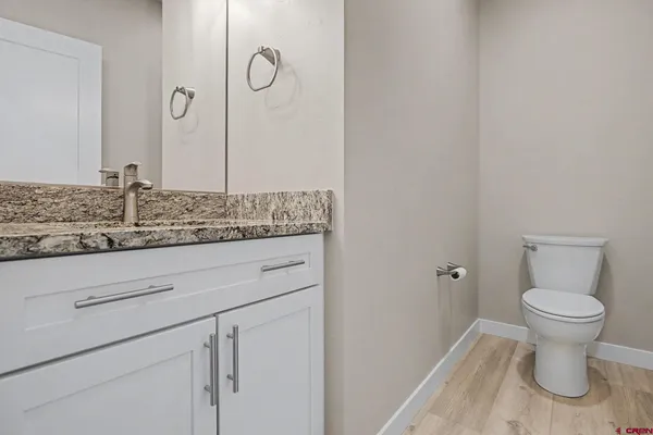 a bathroom with a toilet and a sink