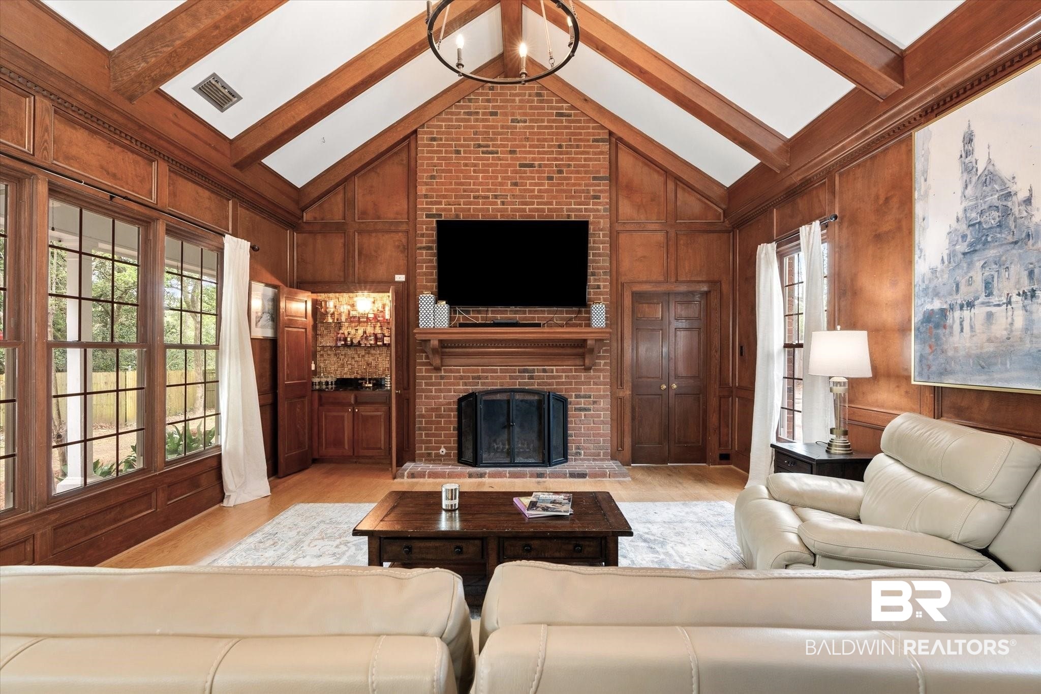 5324 Oak Bend Court Mobile, AL 36609 - Photo 13 of 49 Living area featuring light wood-style flooring, wood walls, and beam ceiling