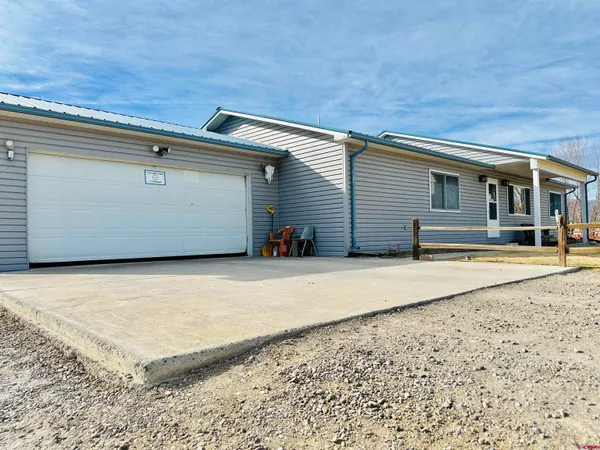 a view of garage and yard