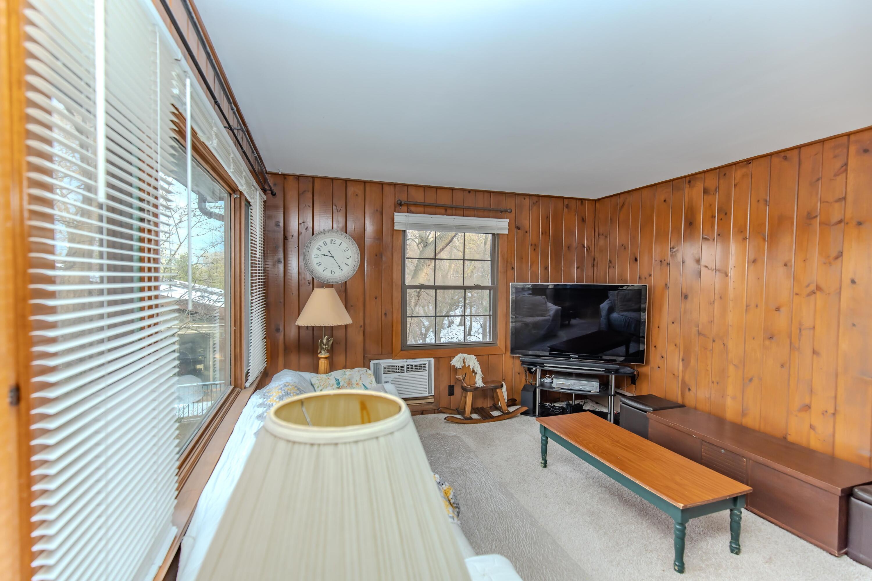 30 Sunset Trail Portage, IN 46368 - Photo 11 of 47 a living room with furniture a flat screen tv and a window