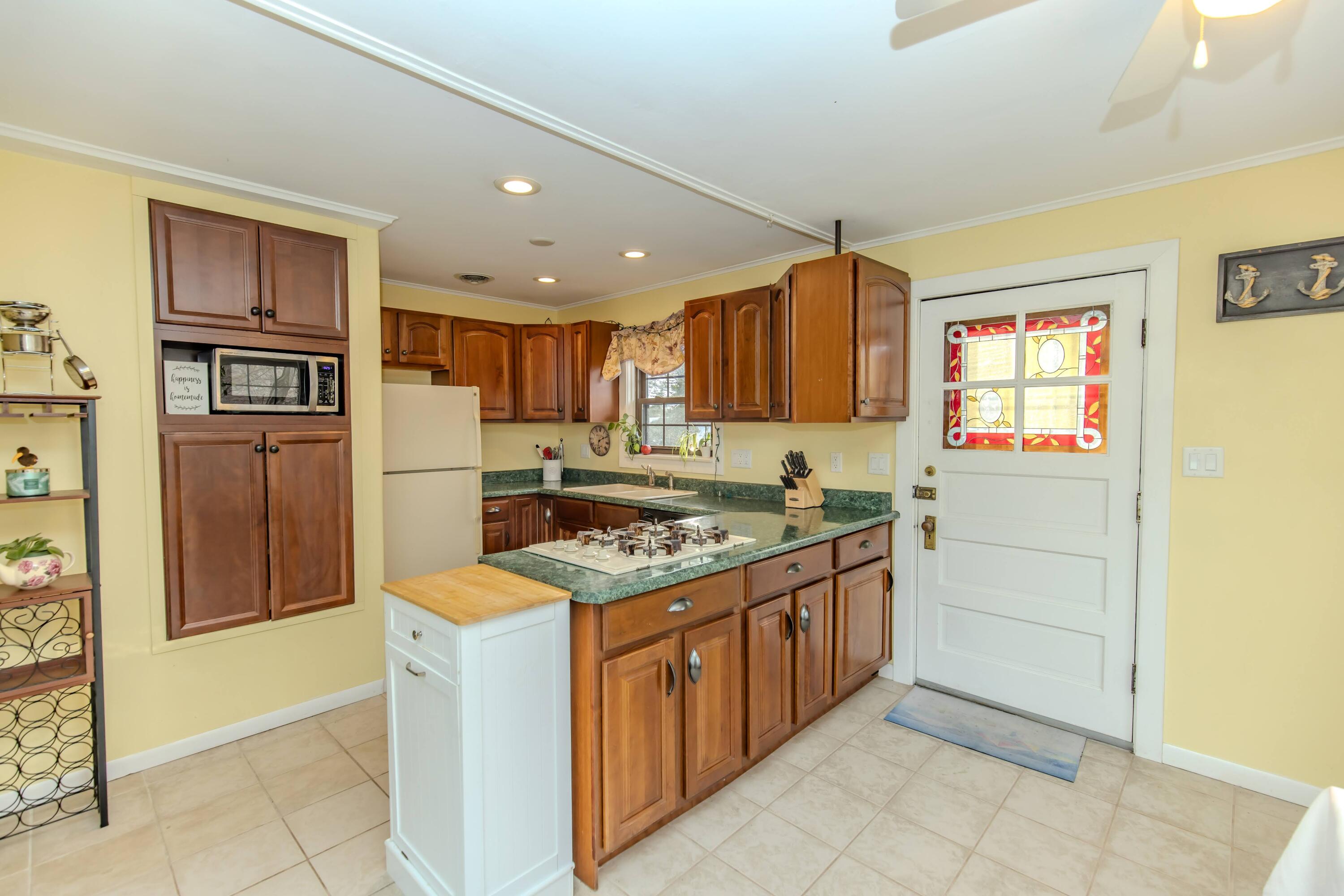 30 Sunset Trail Portage, IN 46368 - Photo 19 of 47 a kitchen with a stove a refrigerator and a sink