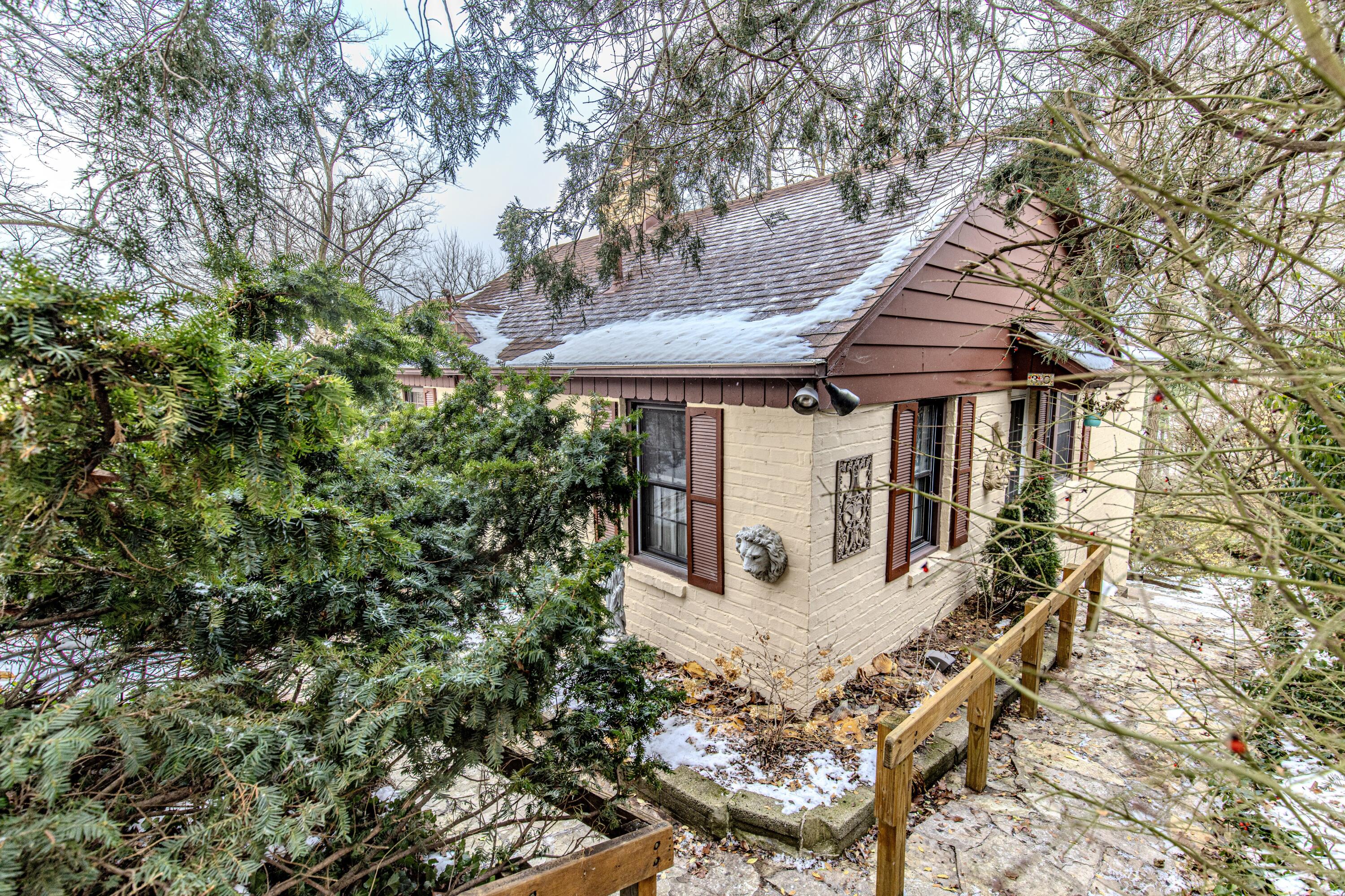 30 Sunset Trail Portage, IN 46368 - Photo 2 of 47 a house with trees in front of it