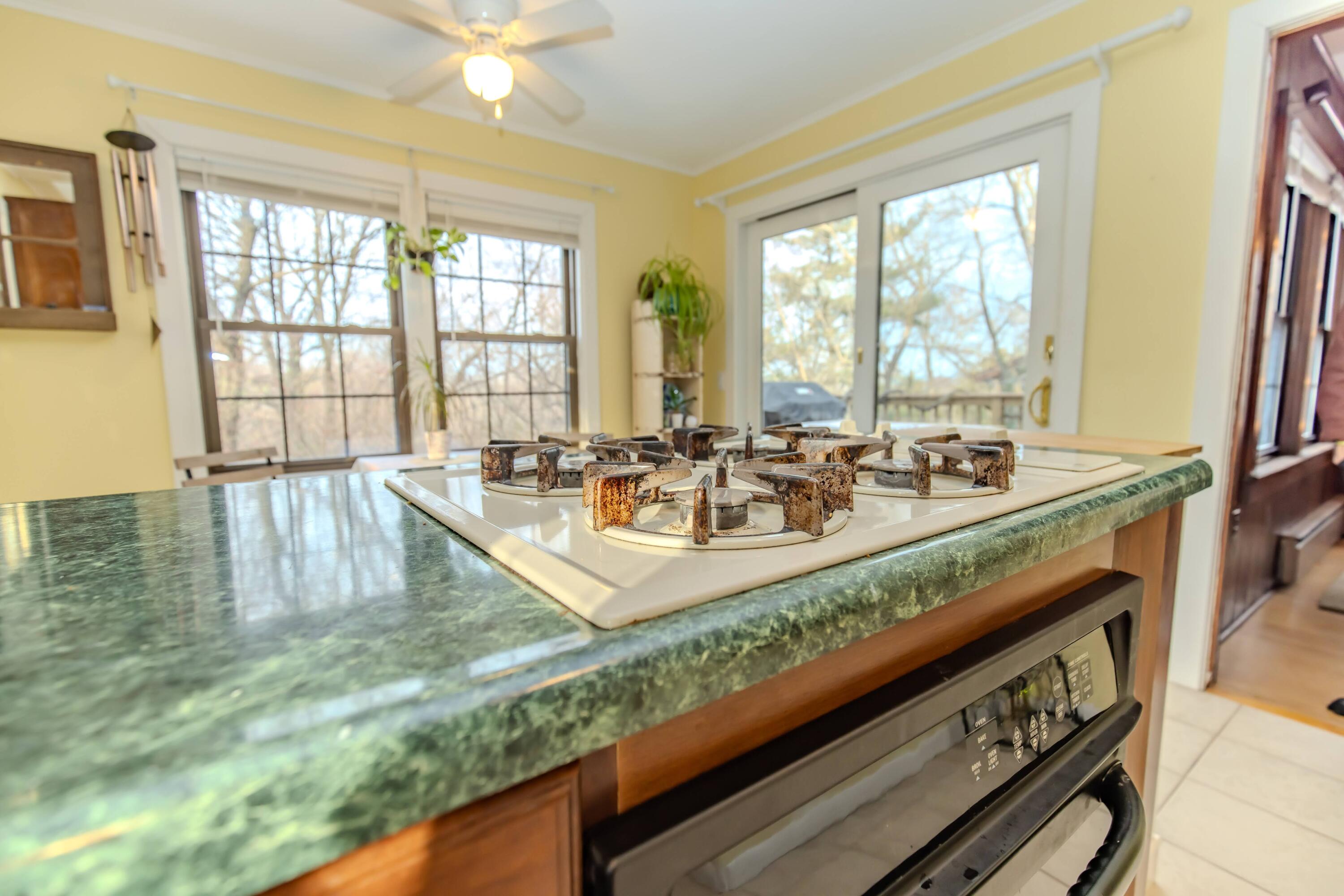 30 Sunset Trail Portage, IN 46368 - Photo 23 of 47 a large kitchen with kitchen island granite countertop a large window