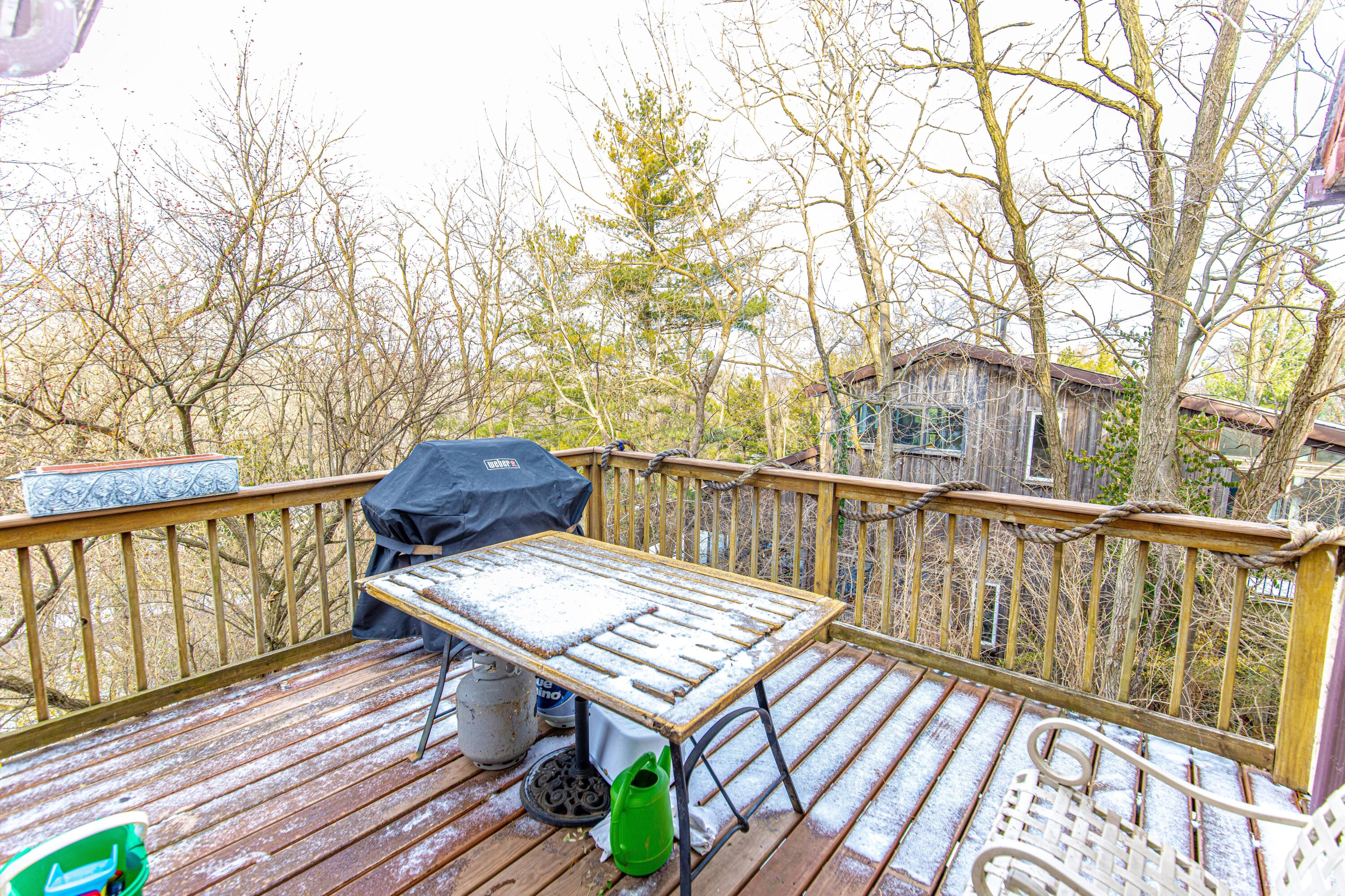30 Sunset Trail Portage, IN 46368 - Photo 28 of 47 a view of a balcony with wooden floor and bench