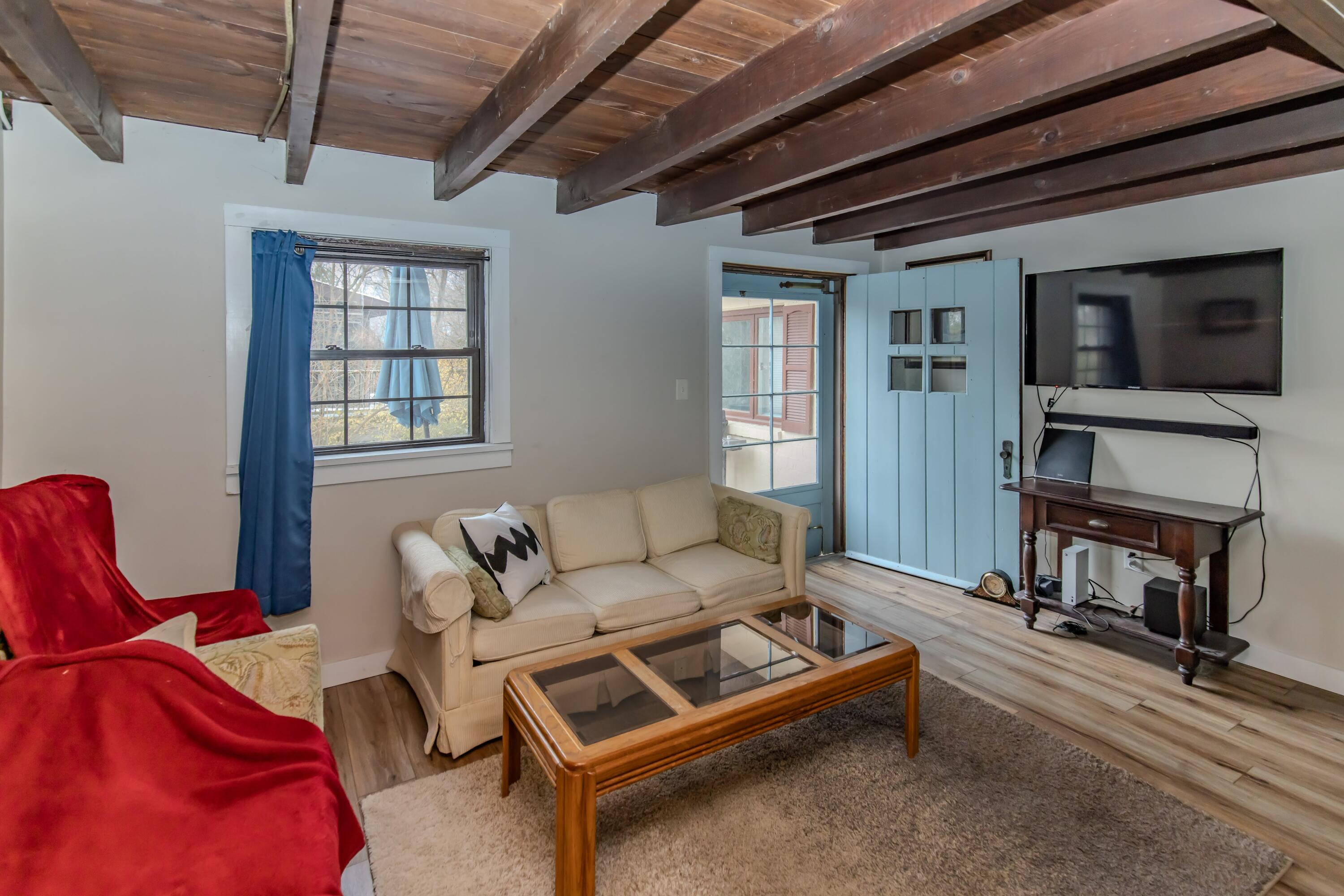 30 Sunset Trail Portage, IN 46368 - Photo 43 of 47 a living room with furniture a flat screen tv and a window