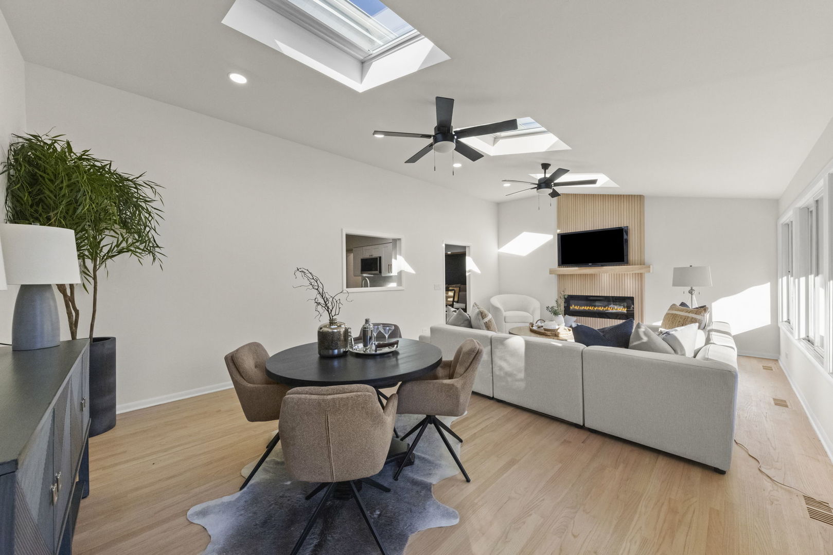 2823 Cooper Court Woodridge, IL 60517 - Photo 11 of 32 a living room with furniture a flat screen tv and a fireplace