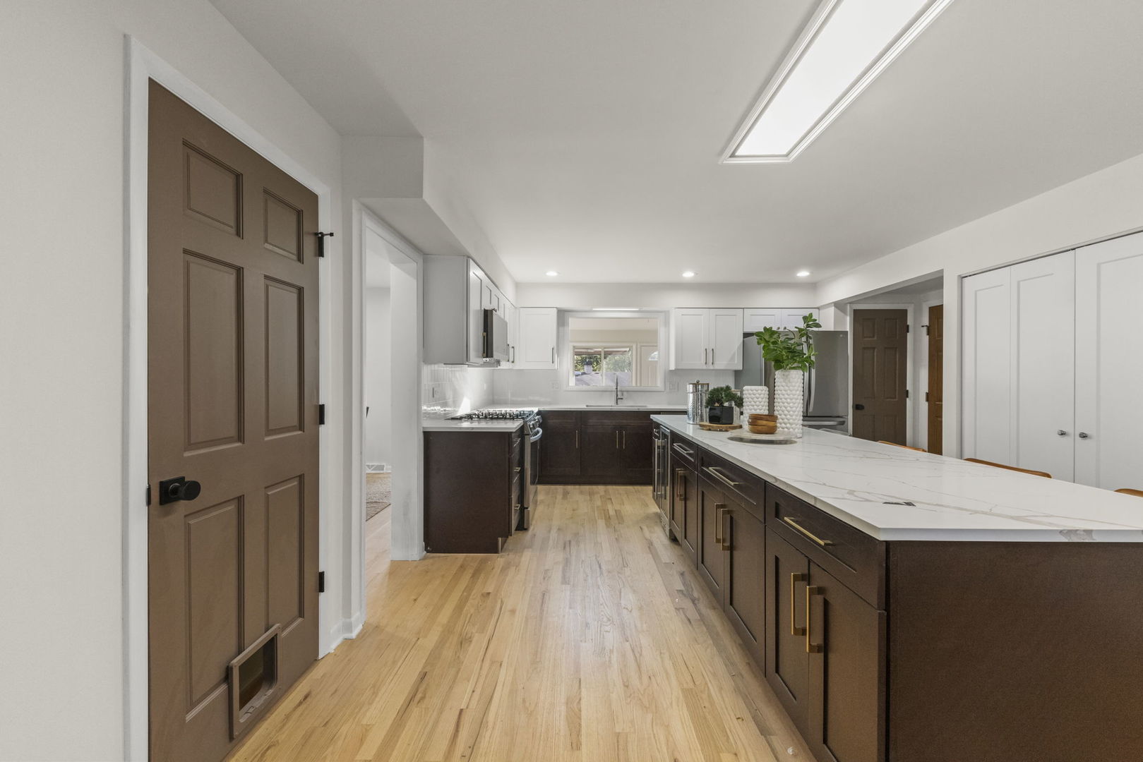 2823 Cooper Court Woodridge, IL 60517 - Photo 14 of 32 a kitchen with stainless steel appliances granite countertop a refrigerator a sink dishwasher a stove and a oven with wooden floor