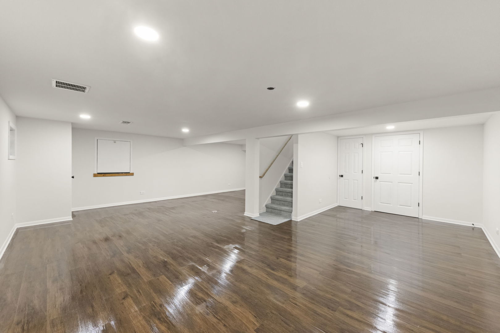 2823 Cooper Court Woodridge, IL 60517 - Photo 28 of 32 an empty room with wooden floor and windows