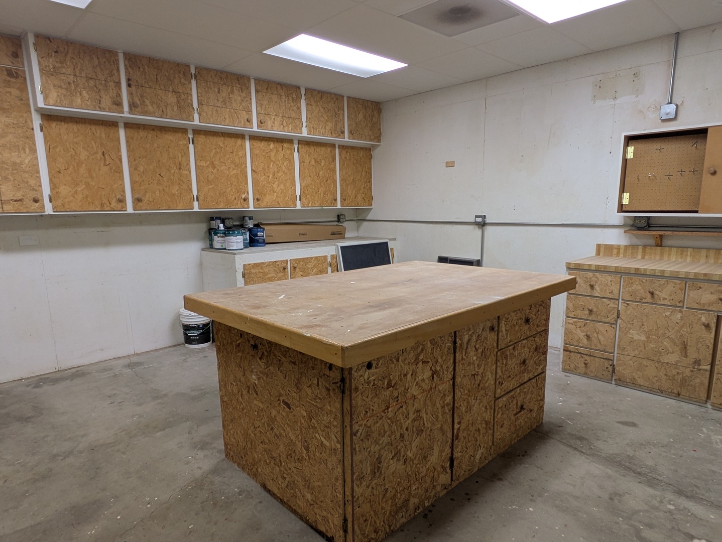 2823 Cooper Court Woodridge, IL 60517 - Photo 30 of 32 a kitchen with a stove a sink and a refrigerator with white cabinets