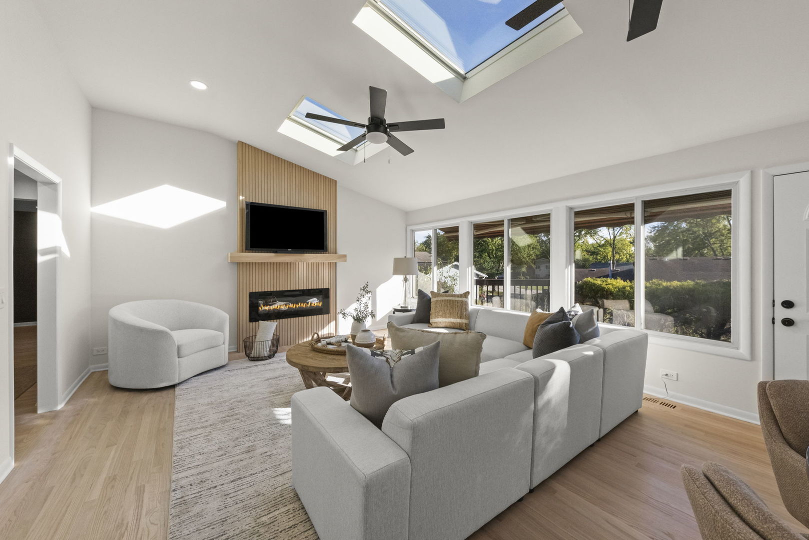 2823 Cooper Court Woodridge, IL 60517 - Photo 9 of 32 a living room with fireplace furniture and a flat screen tv