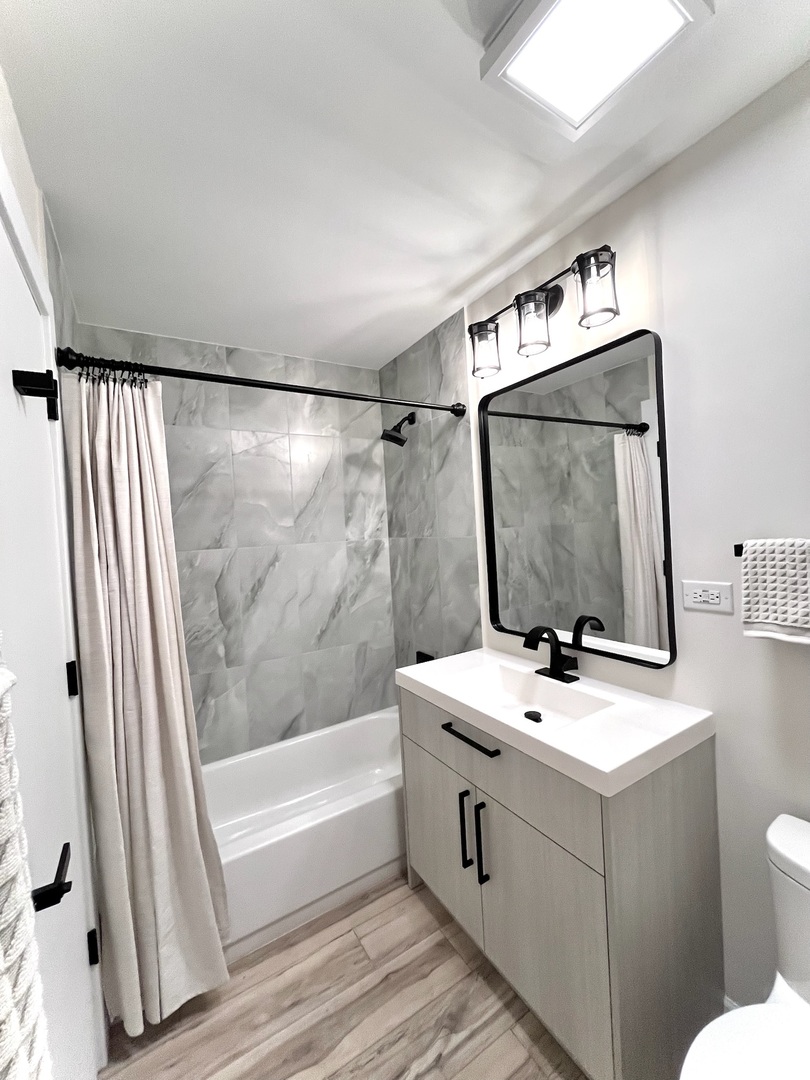 244 East Rimini Court Palatine, IL 60067 - Photo 4 of 8 a bathroom with a sink a toilet and a mirror