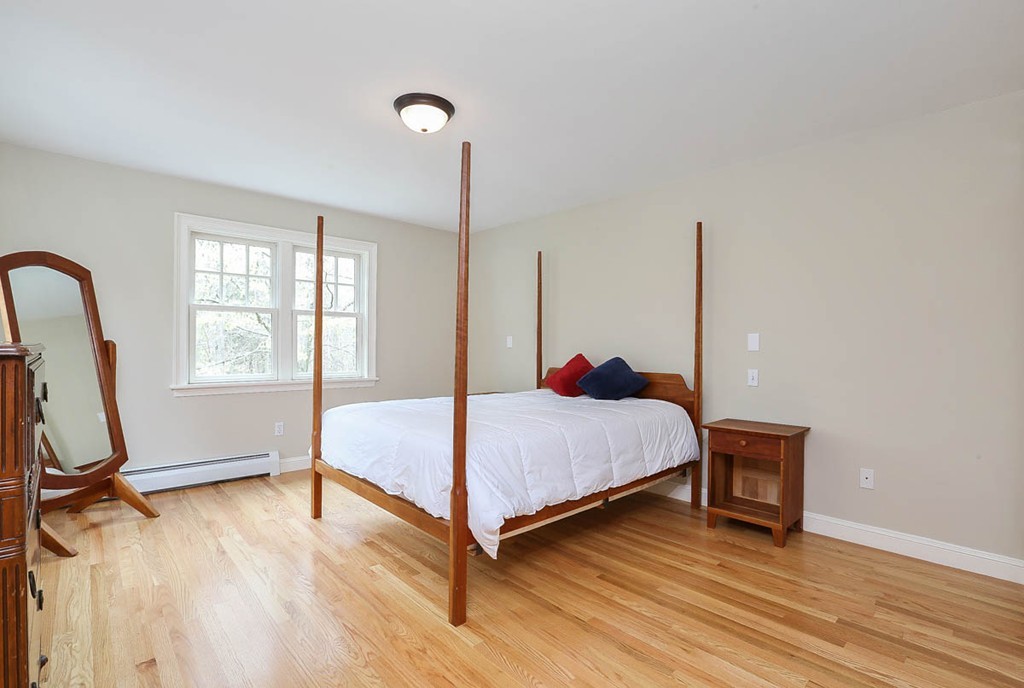 10 Woodside Road Topsfield, MA 01983 - Photo 14 of 30 a bed room with a bed and a window