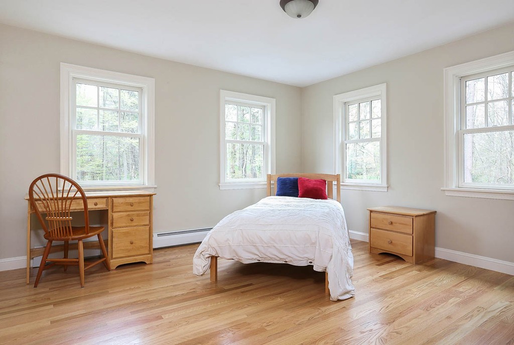 10 Woodside Road Topsfield, MA 01983 - Photo 15 of 30 a bedroom with a bed and a window