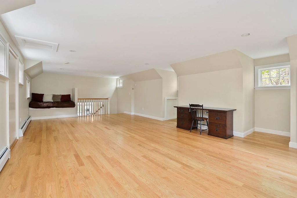 10 Woodside Road Topsfield, MA 01983 - Photo 19 of 30 a room with a bed and a view of kitchen