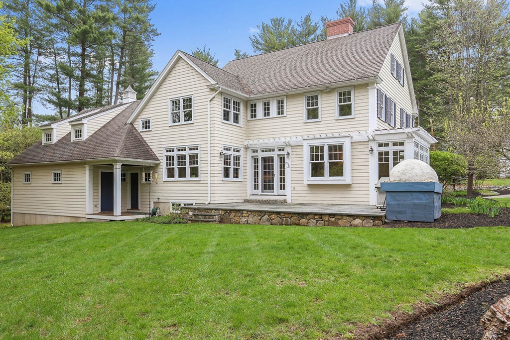 10 Woodside Road Topsfield, MA 01983 - Photo 2 of 30 a front view of a house with a yard and trees