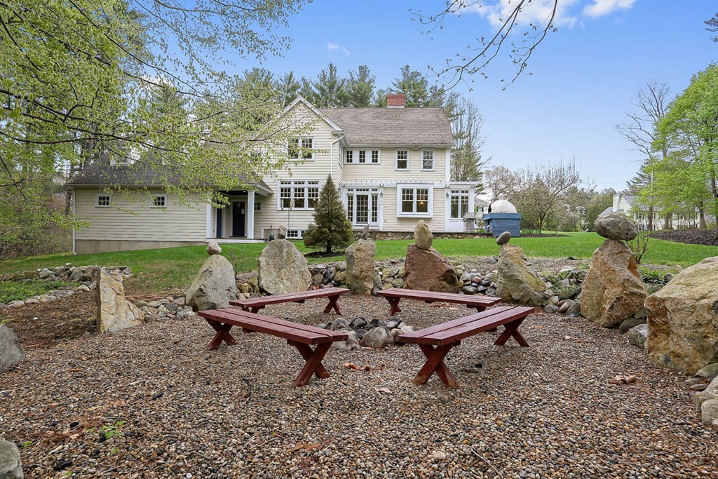 10 Woodside Road Topsfield, MA 01983 - Photo 24 of 30 a view of a house with backyard porch and sitting area