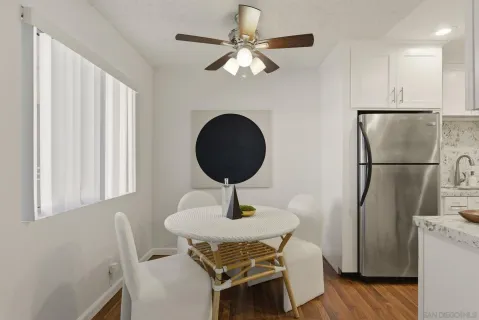 a dining room with furniture and wooden floor