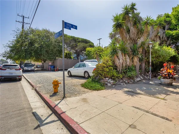 a view of a street with cars