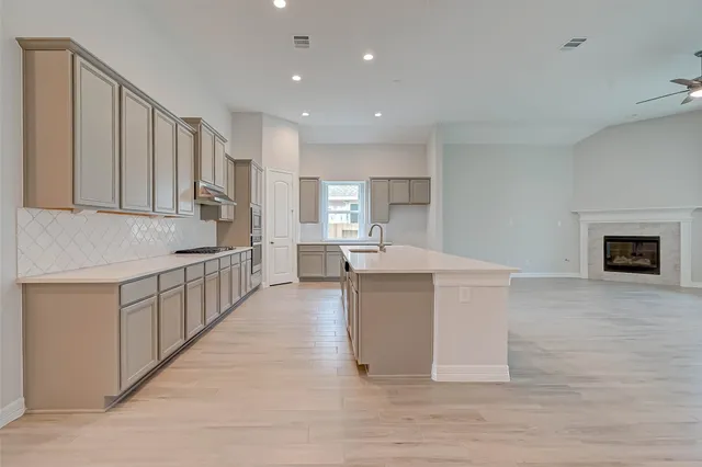 a kitchen with white cabinets