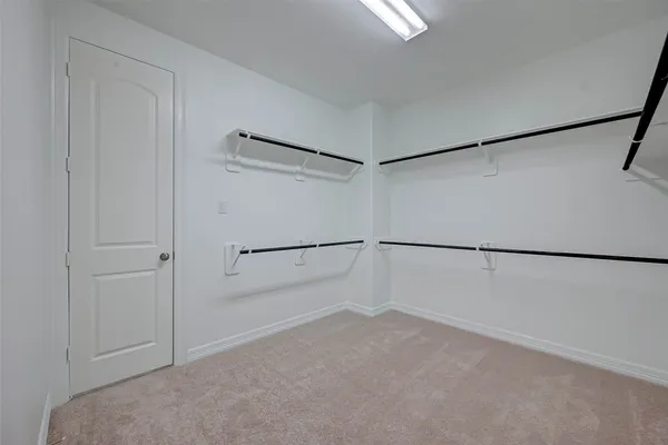 a view of a room with an empty walk in closet