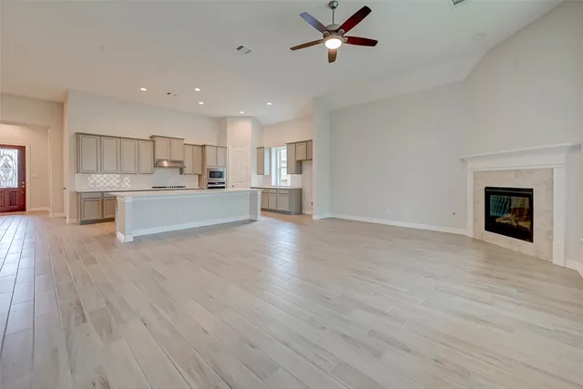 a view of a kitchen with wooden floor and a kitchen