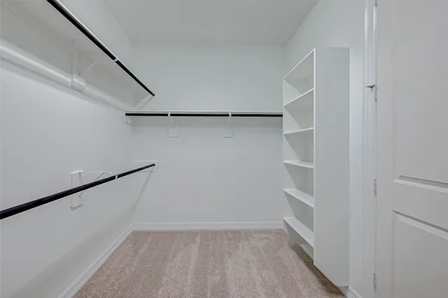 a view of an empty walk in closet