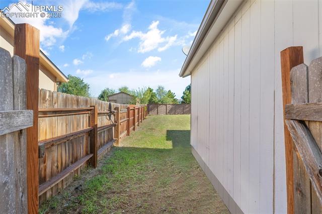 4469 Fenton Road Colorado Springs, CO 80916 - Photo 34 of 38 View of fenced sideyard