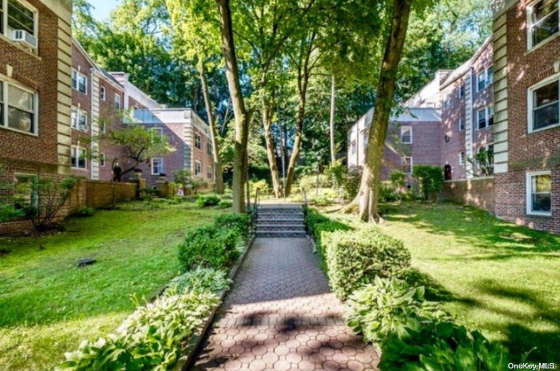 822 Palmer Road, Unit 2B Yonkers, NY 10708 - Photo 1 of 1 a view of a pathway both side of the house