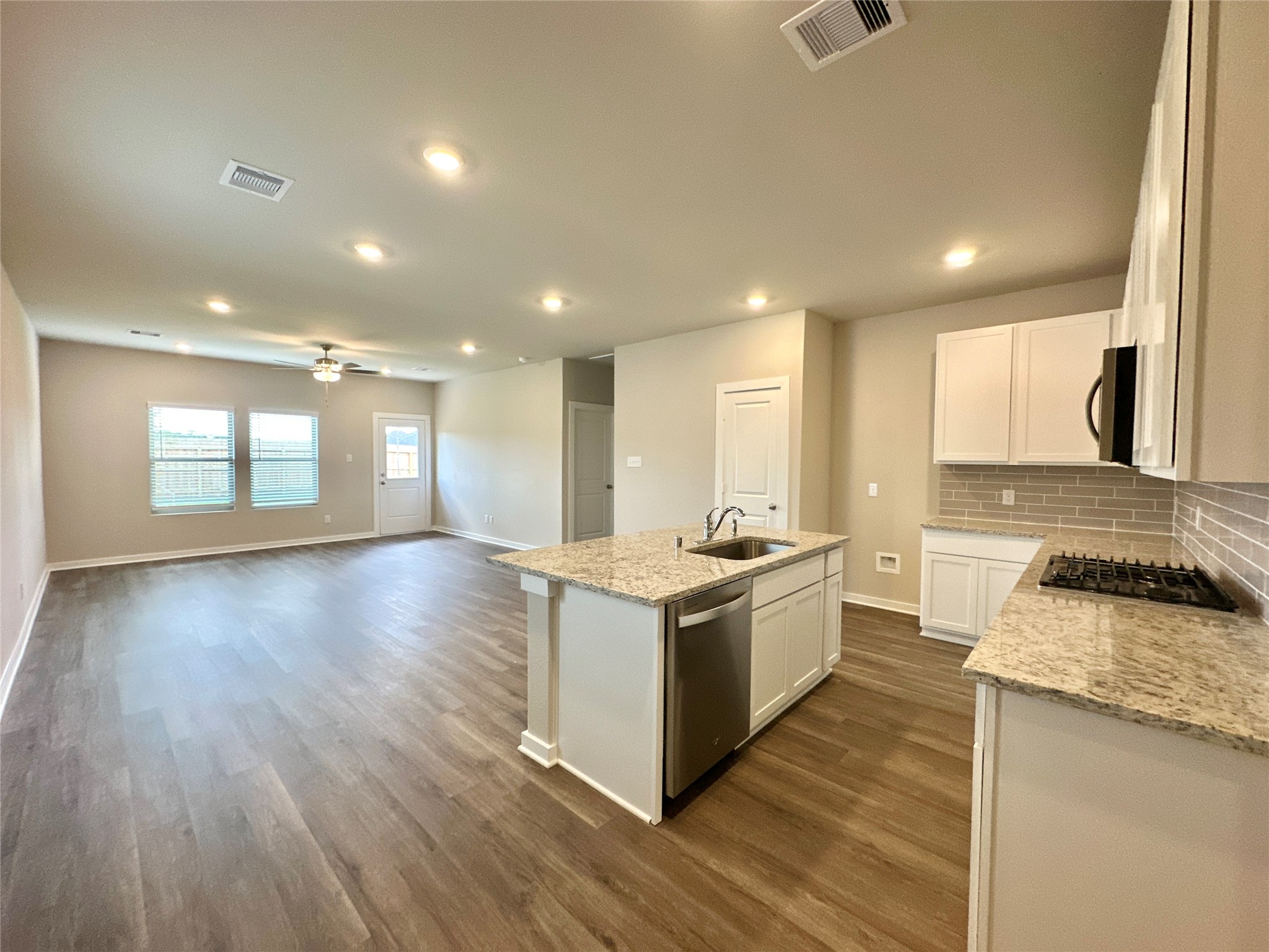 12164 Ridge Top Drive Conroe, TX 77304 - Photo 4 of 23 a kitchen with a stove and a sink