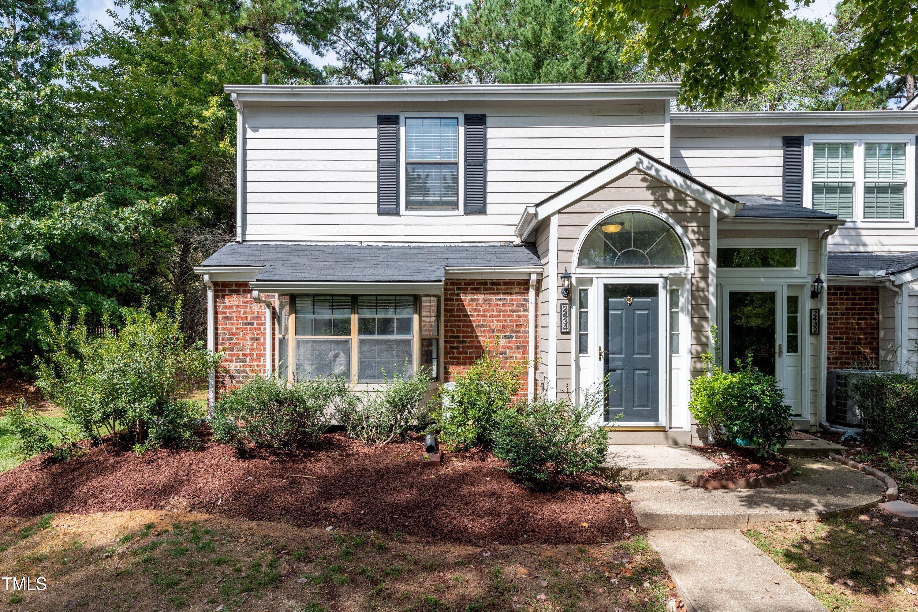 2434 Condor Court Raleigh, NC 27615 - Photo 1 of 21 front view of a house with a yard