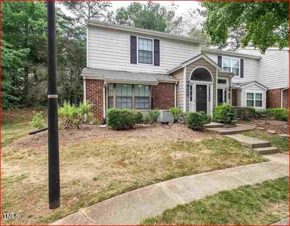 2434 Condor Court Raleigh, NC 27615 - Photo 2 of 21 a front view of a house with garden