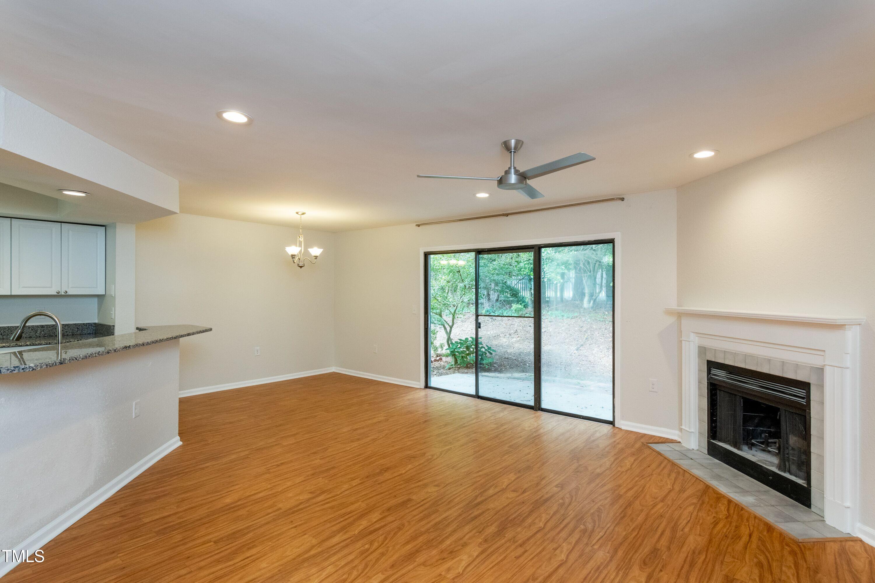 2434 Condor Court Raleigh, NC 27615 - Photo 10 of 21 a view of a kitchen with a sink and a fireplace