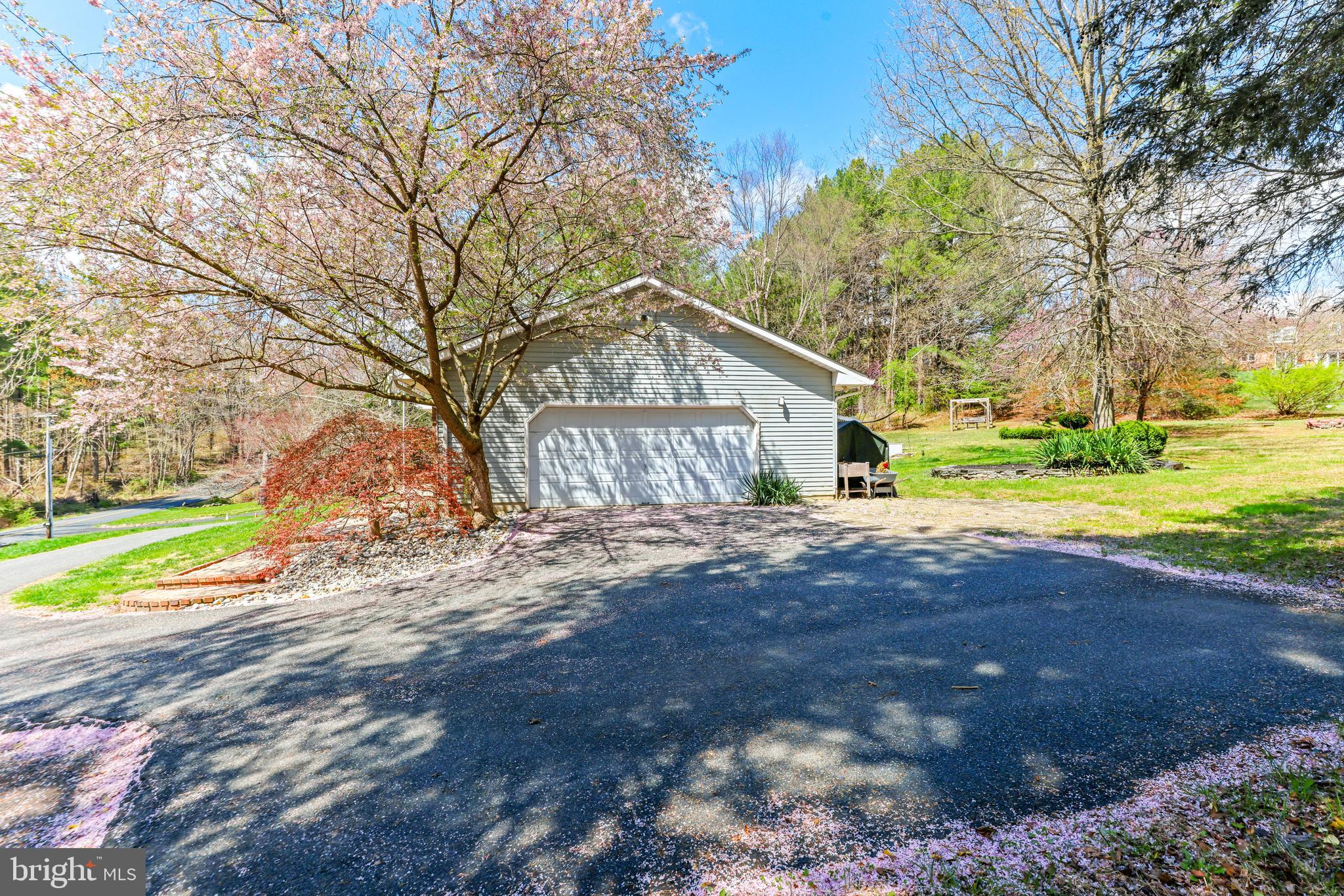 2847 Moores Road Baldwin, MD 21013 - Photo 57 of 73 a front view of a house with a yard and garage