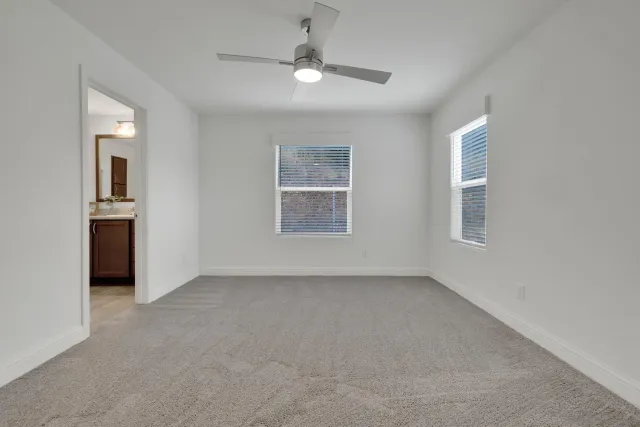 a bathroom with a double vanity sink toilet and shower
