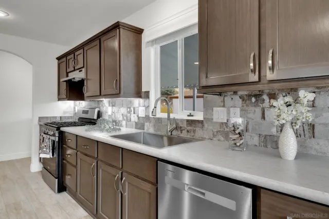 a view of kitchen with cabinets and stainless steel appliances