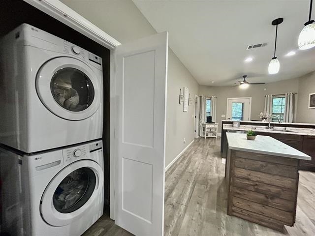 100 Shadow Brook Circle Counce, TN 38326 - Photo 11 of 39 a view of a kitchen with a sink and a washer dryer