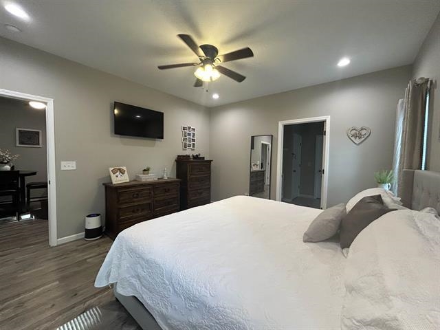 100 Shadow Brook Circle Counce, TN 38326 - Photo 13 of 39 a bedroom with a bed and a flat screen tv