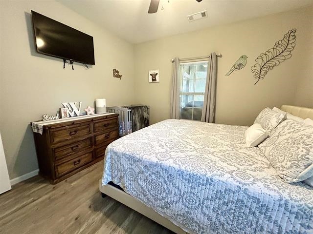 100 Shadow Brook Circle Counce, TN 38326 - Photo 20 of 39 a bedroom with a bed and flat screen tv