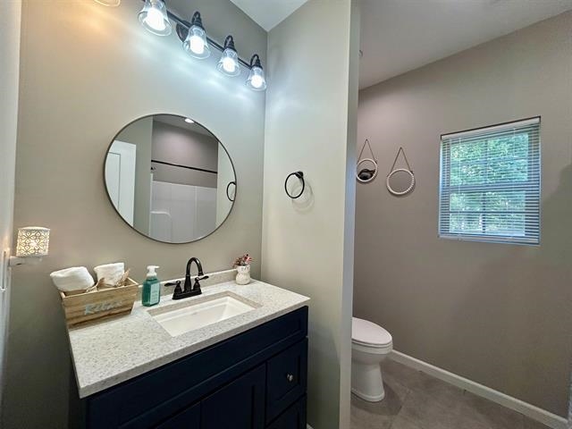 100 Shadow Brook Circle Counce, TN 38326 - Photo 21 of 39 a bathroom with a granite countertop sink mirror and toilet