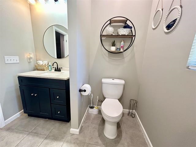100 Shadow Brook Circle Counce, TN 38326 - Photo 22 of 39 a bathroom with a toilet sink vanity and mirror