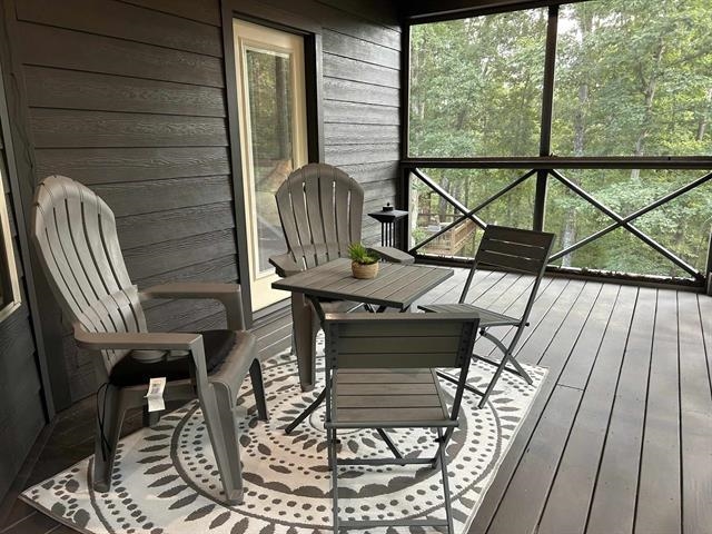 100 Shadow Brook Circle Counce, TN 38326 - Photo 23 of 39 Sunroom / solarium featuring outdoor dining space, healthy amount of natural light, and a wooden deck