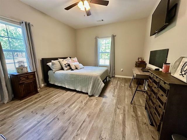 100 Shadow Brook Circle Counce, TN 38326 - Photo 24 of 39 a bedroom with a bed and wooden floor
