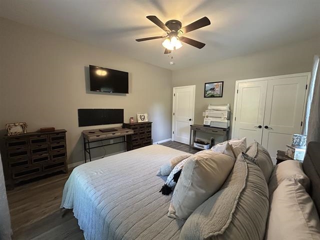 100 Shadow Brook Circle Counce, TN 38326 - Photo 25 of 39 a bedroom with a bed and a flat screen tv