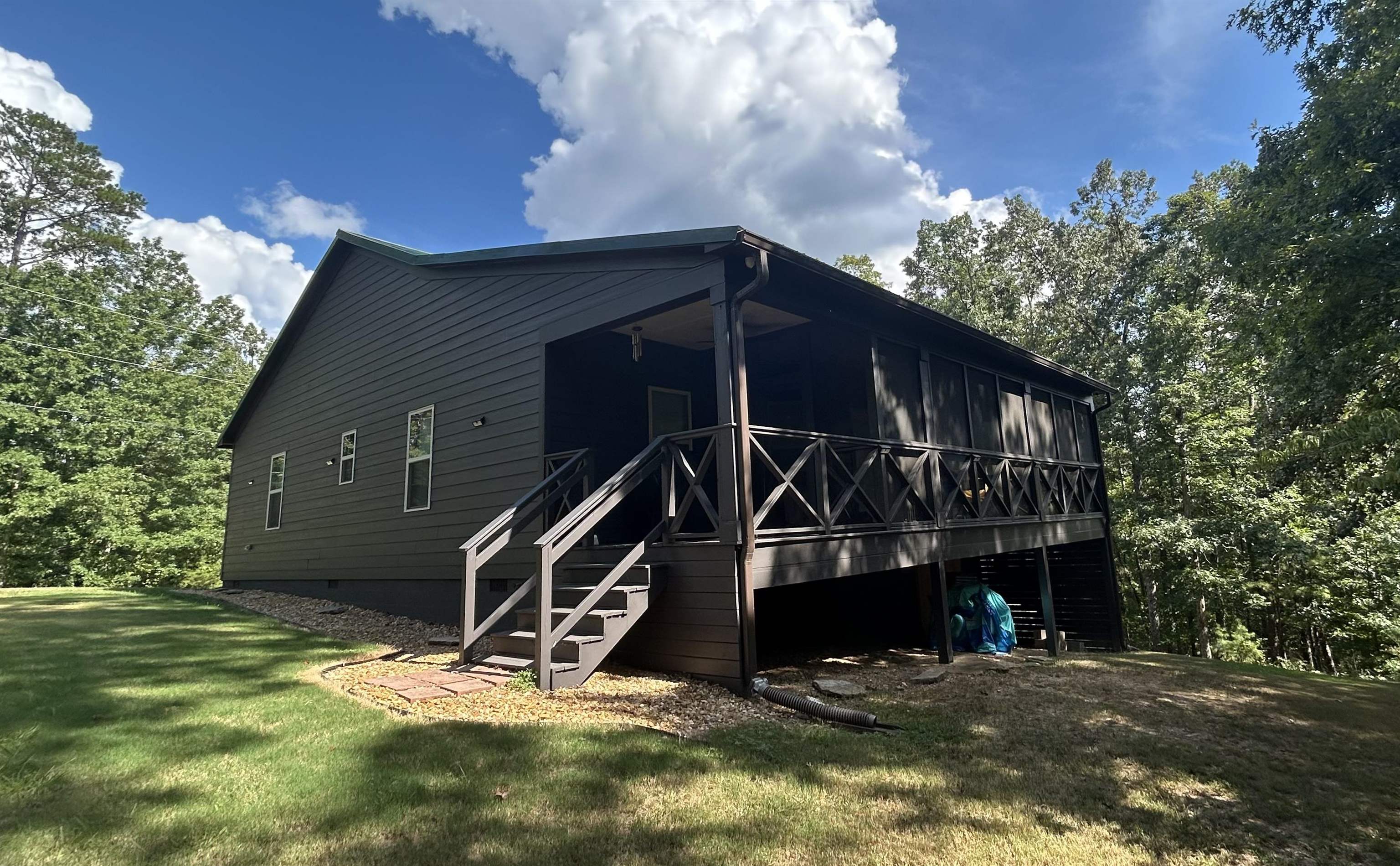 100 Shadow Brook Circle Counce, TN 38326 - Photo 10 of 39 Back of property featuring a sunroom, a lawn, and a wooden deck