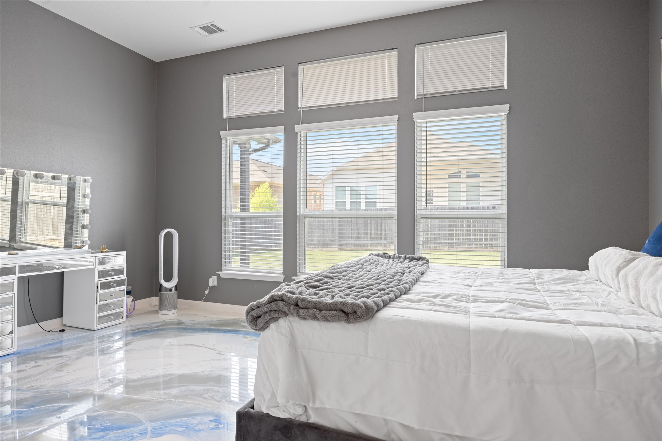 241 Oleander Loop Buda, TX 78610 - Photo 15 of 33 a bedroom with a bed a table and next to a window