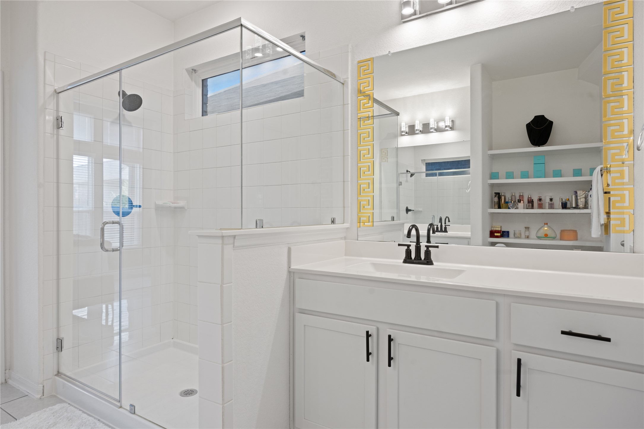 241 Oleander Loop Buda, TX 78610 - Photo 17 of 33 a bathroom with a sink and a mirror