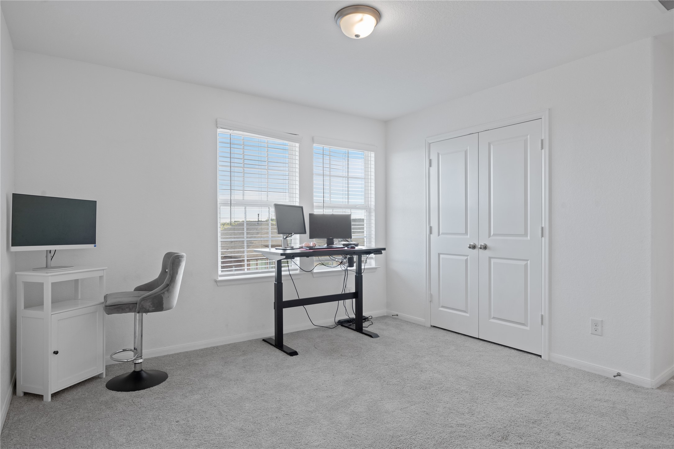 241 Oleander Loop Buda, TX 78610 - Photo 21 of 33 a view of a workspace with furniture and a window