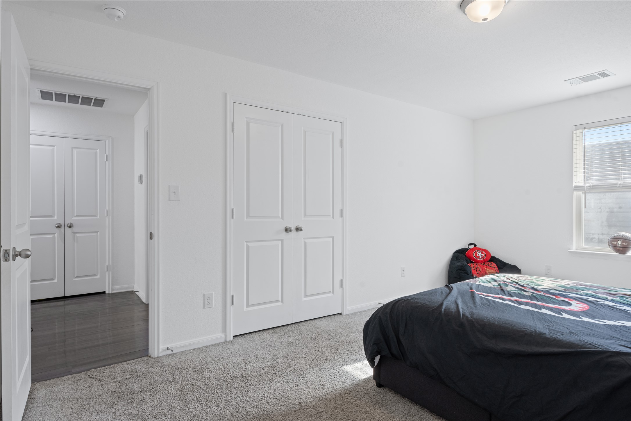 241 Oleander Loop Buda, TX 78610 - Photo 26 of 33 a bedroom with a bed and a window